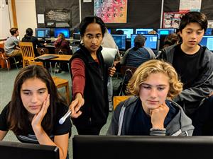 Students and instructor at computer