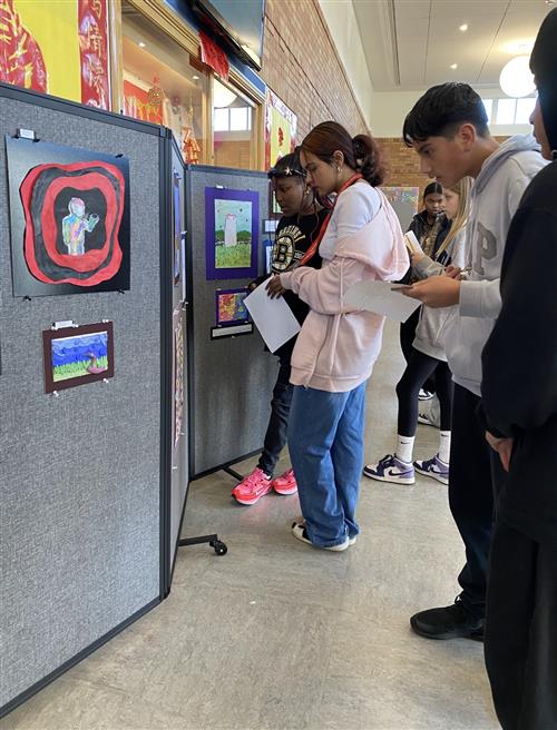 students looking at art