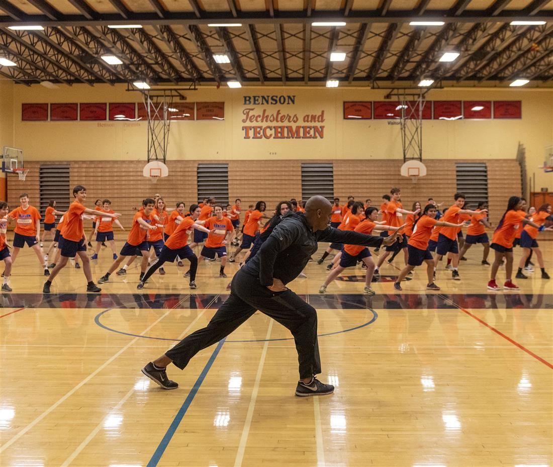 Students in gym class with instructor