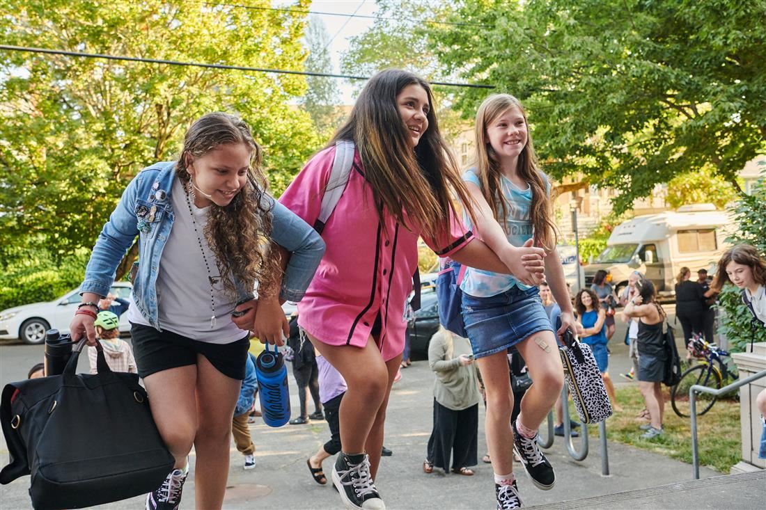Kids outside on their way to school