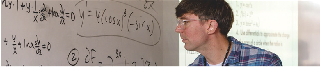 math instructor in front of whiteboard